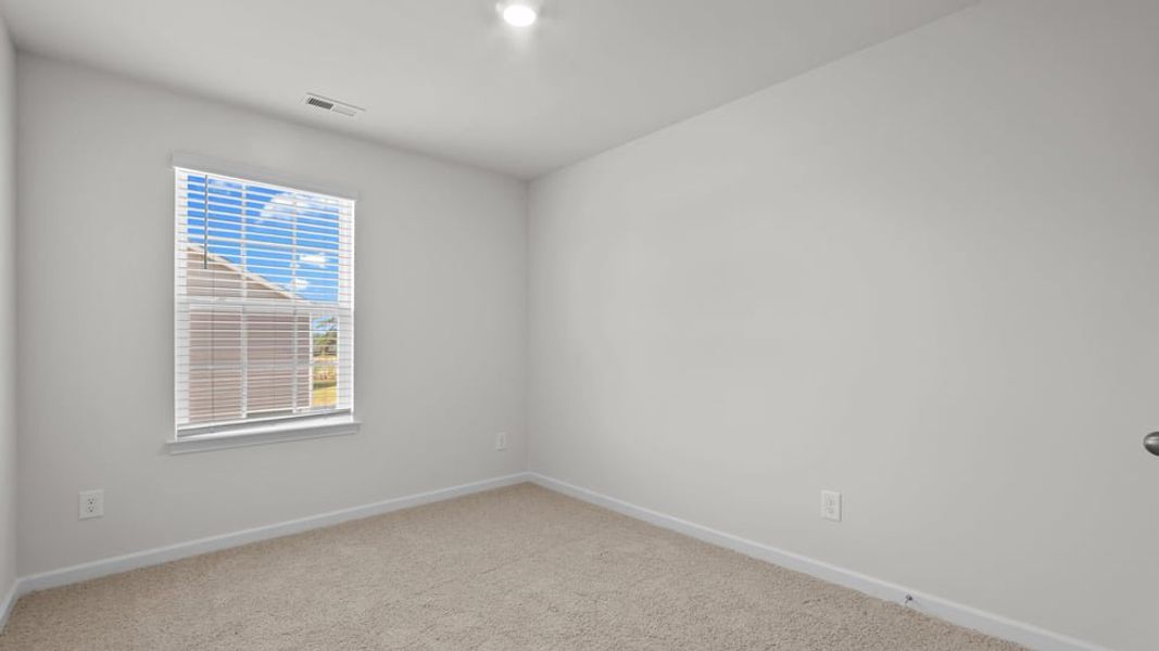 Spacious, unfurnished interior of a new home in The Townes at Ridgewood Farms, Winterville (Image 31).