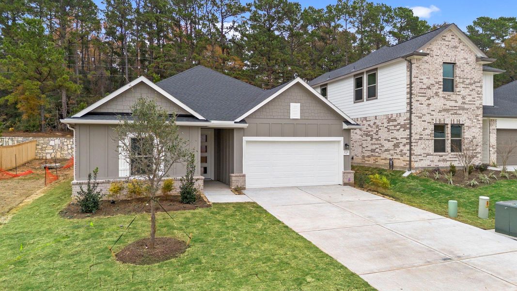 Front exterior of a new home in Westridge Cove, Conroe, TX, highlighting curb appeal (Image 18).
