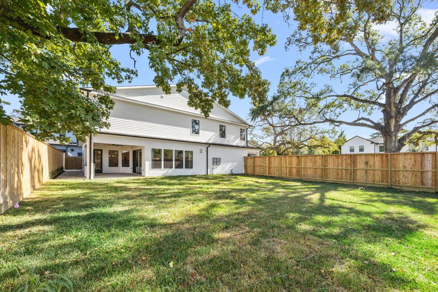 4902 Oak Forest is situated on a double lot on the corner, providing an extra large front and back yard space, large enough for a pool and then some! Full Summer Kitchen on the covered patio.