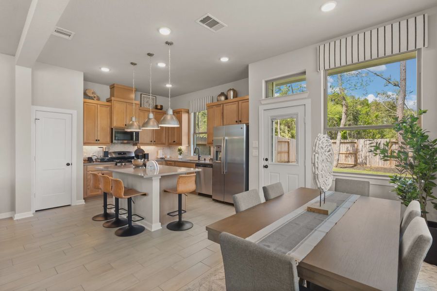 Representative furnished interior of a home built from the Chantilly by Chesmar Homes in The Woodland Hills Chateau, Willis (Image 5).