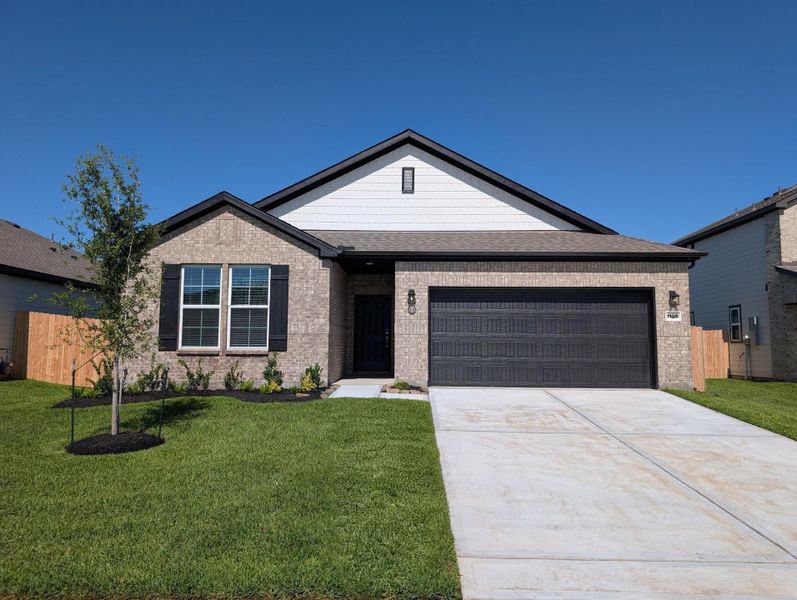 Front exterior of a new home in Valor Park, Bay City, TX, highlighting curb appeal (Image 2). Front exterior of a new home in Valor Park, Bay City, TX, highlighting curb appeal (Image 2).