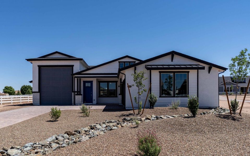 Front exterior of a new home in Heritage Pointe, Chino Valley, AZ, highlighting curb appeal (Image 1). Front exterior of a new home in Heritage Pointe, Chino Valley, AZ, highlighting curb appeal (Image 1).