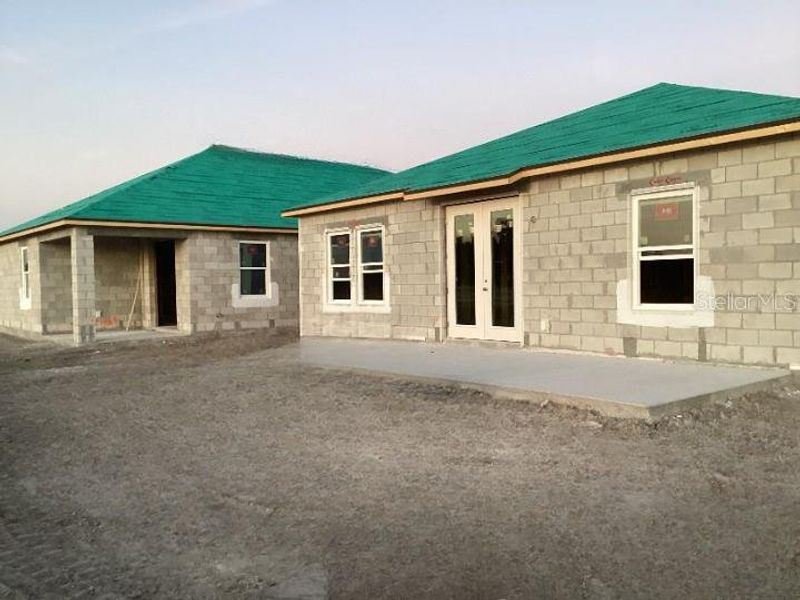 Exterior details and patio area of a home in Catamaran Cove Traditional, Rockledge (Image 2).
