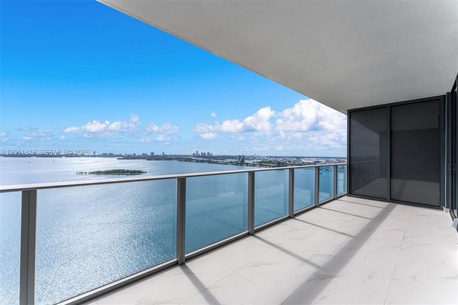 Breathtaking panoramic sunrise views of Biscayne Bay and the Atlantic Ocean from the expansive private terrace of Aria Reserve #2504 in Edgewater, Miami.