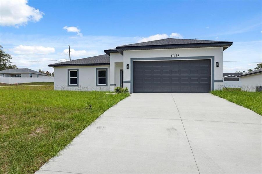 Front exterior of a new home in , Ocala, FL, highlighting curb appeal (Image 28).