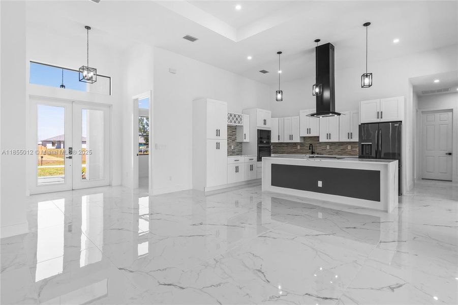 hefs Dream Kitchen features a Custom Island with Waterfall