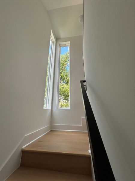 Windows on stairwell for extra natural light Windows on stairwell for extra natural light