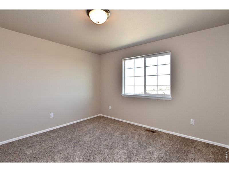 Spacious, unfurnished interior of a new home in Union Colony West, Greeley (Image 31).