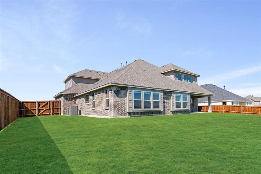 Exterior details and patio area of a home in Wildcat Ridge Phase 3, Godley (Image 3).
