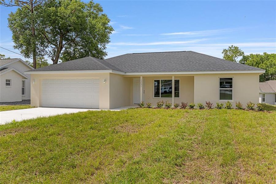 Front exterior of a new home in , Ocklawaha, FL, highlighting curb appeal (Image 25). Front exterior of a new home in , Ocklawaha, FL, highlighting curb appeal (Image 25).