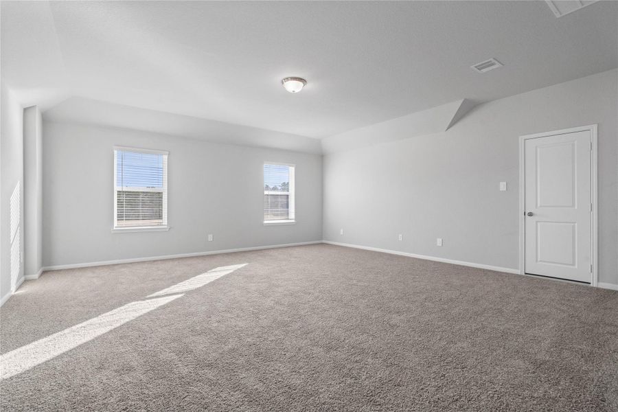 Ascend to this versatile second-floor Game Room! This spacious, bright and inviting room provides abundant natural light. It offers endless possibilities—envision a cozy media room, a productive home office, a vibrant play area, or a quiet reading nook—adapting easily to the buyer's needs.