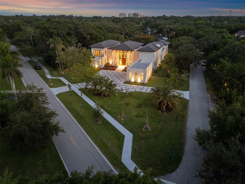 Front exterior of a new home in , Pinecrest, FL, highlighting curb appeal (Image 2).