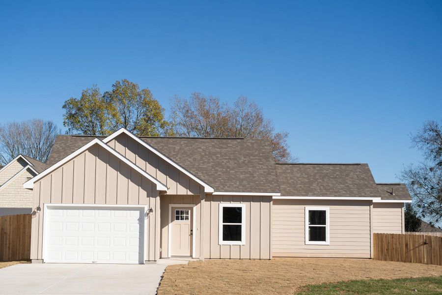 Front exterior of a new home in , Smithville, TX, highlighting curb appeal (Image 1). Front exterior of a new home in , Smithville, TX, highlighting curb appeal (Image 1).