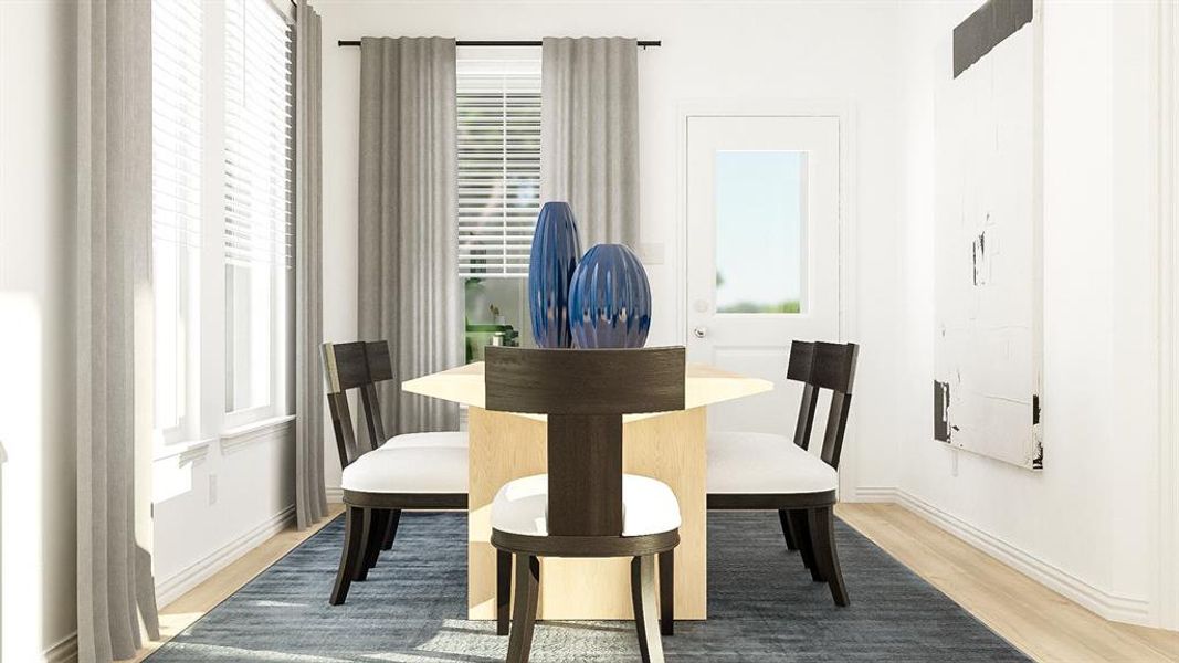 Dining space with light hardwood / wood-style flooring