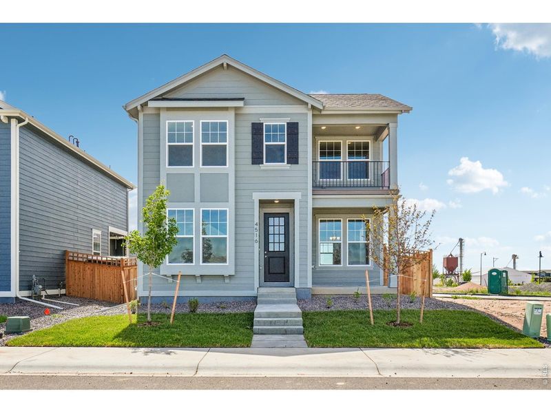 Front exterior of a new home in Timnath Lakes, Timnath, CO, highlighting curb appeal (Image 2). Front exterior of a new home in Timnath Lakes, Timnath, CO, highlighting curb appeal (Image 2).