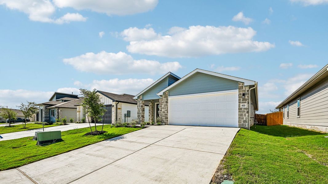 Front exterior of a new home in Southgrove, Kyle, TX, highlighting curb appeal (Image 24).