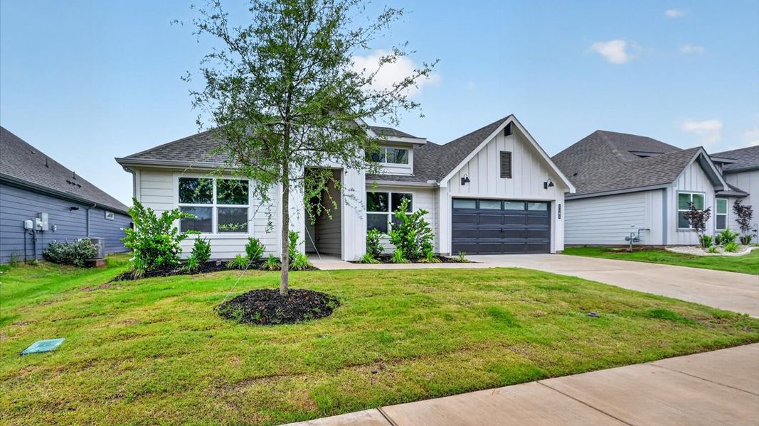 Front exterior of a new home in Sandstone Estates, Granbury, TX, highlighting curb appeal (Image 2). Front exterior of a new home in Sandstone Estates, Granbury, TX, highlighting curb appeal (Image 2).