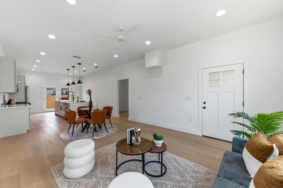 Living area featuring recessed lighting, light wood finished floors, and ceiling fan