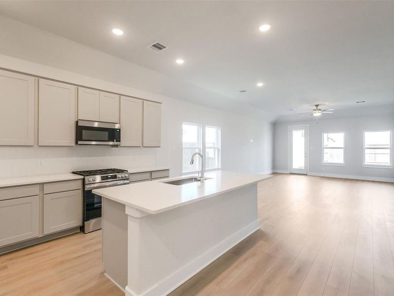 Furnished interior view inside a new home in Sunterra, Katy (Image 9).