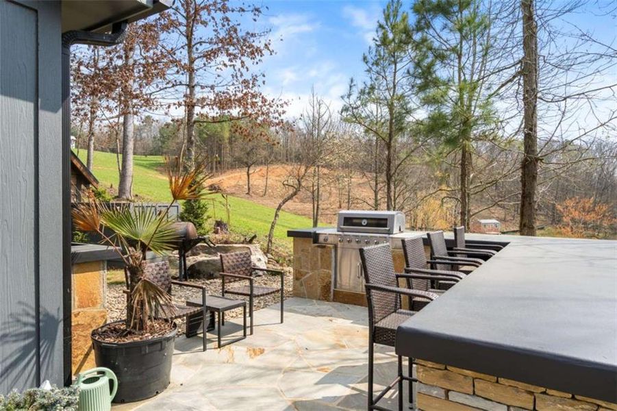 Exterior details and patio area of a home in , Ellijay (Image 30).