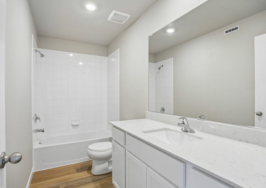 The secondary bathroom has a tub/shower combo.