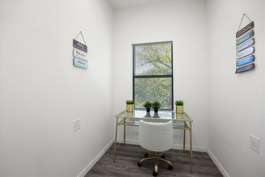 Office space with dark wood-type flooring