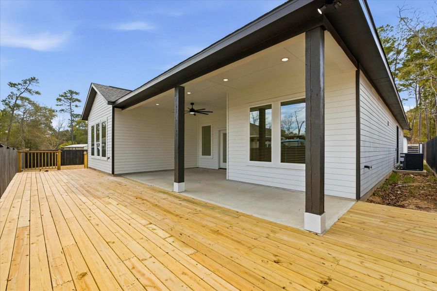 Expansive deck providing additional space to entertain or enjoy the benefits of your generous 12,000 square-foot lot.