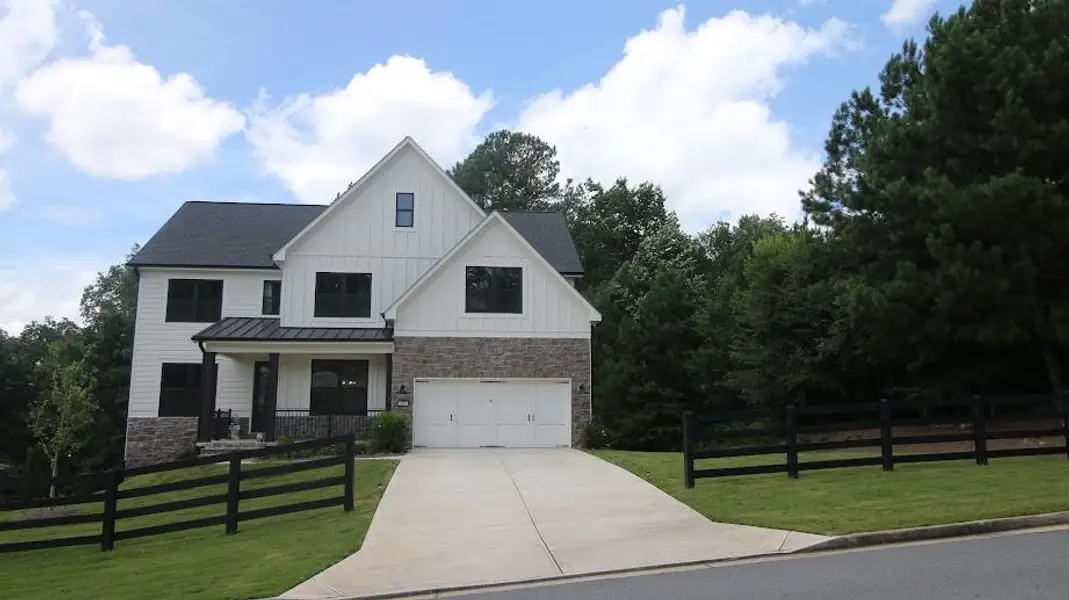 Front exterior of a new home in , Dallas, GA, highlighting curb appeal (Image 1). Front exterior of a new home in , Dallas, GA, highlighting curb appeal (Image 1).