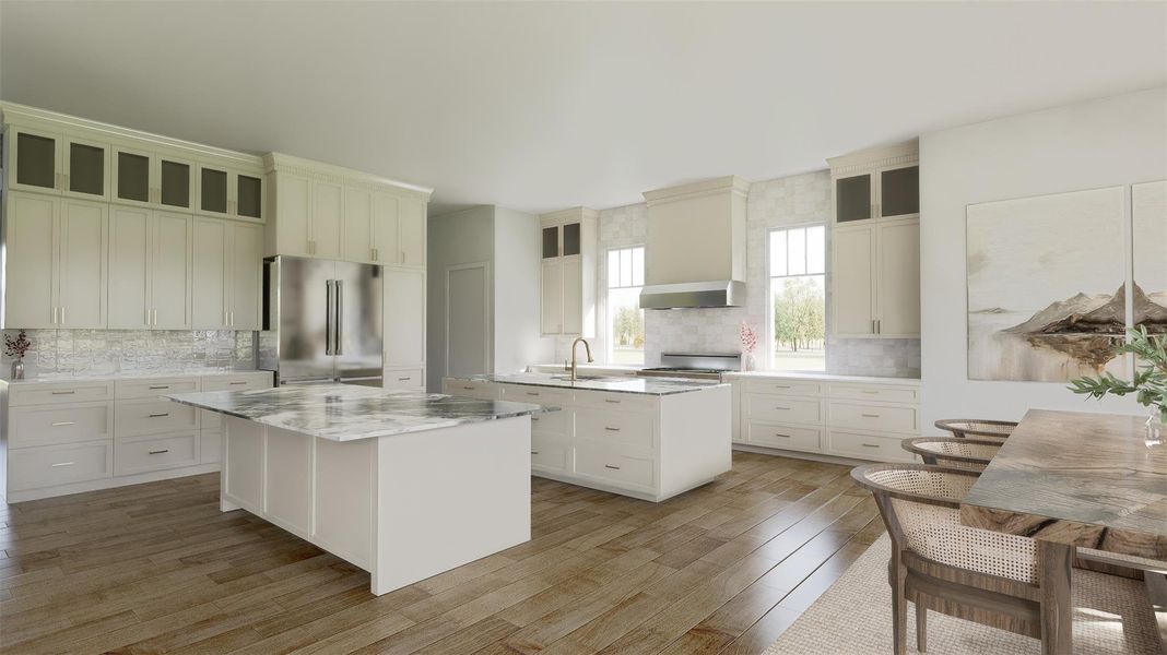 The double island kitchen is truly the heart of the home. Natural light flows through the space. Floor to ceiling cabinets offer ample storage. Wood floors, quartzite countertops and the custom tile backsplash add elegance and warmth. The double island kitchen is truly the heart of the home. Natural light flows through the space. Floor to ceiling cabinets offer ample storage. Wood floors, quartzite countertops and the custom tile backsplash add elegance and warmth.