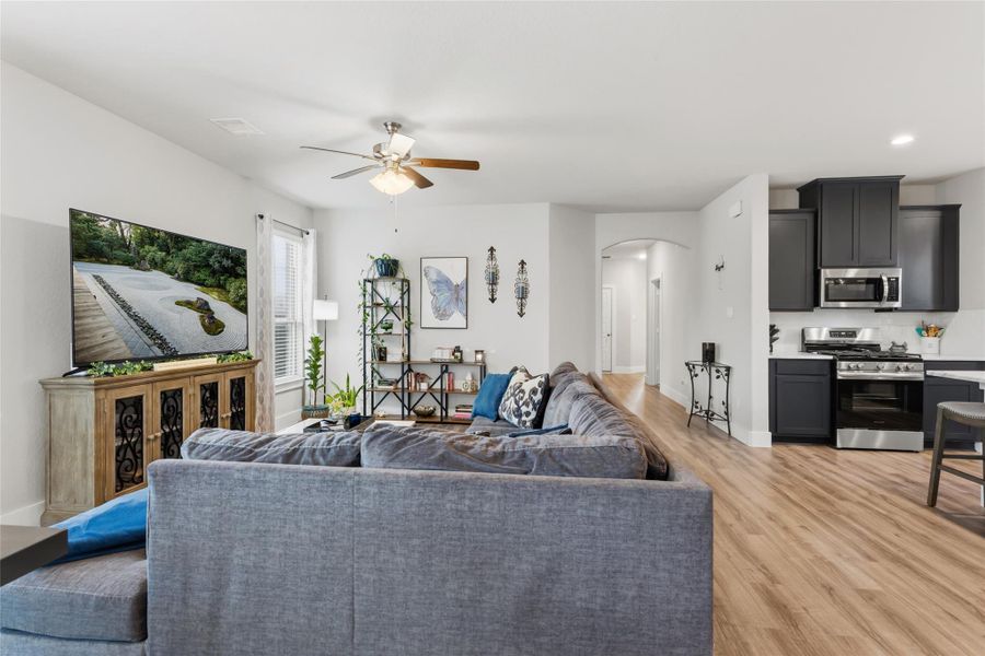 Luxurious, open-concept living room with elegant decor, abundant natural light, and seamless flow to the kitchen. Perfect for entertaining. Luxurious, open-concept living room with elegant decor, abundant natural light, and seamless flow to the kitchen. Perfect for entertaining.