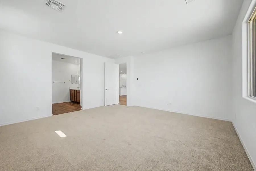 Spacious, unfurnished interior of a new home in Tyler Ranch, Buckeye (Image 12). Spacious, unfurnished interior of a new home in Tyler Ranch, Buckeye (Image 12).