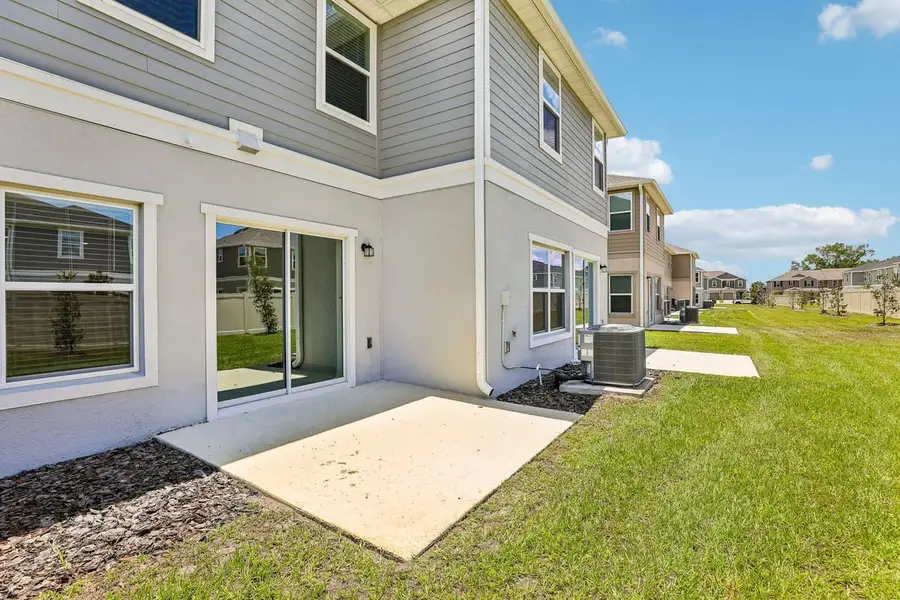 Exterior details and patio area of a home in Reserve at Forest Lake Townhomes, Lake Wales (Image 3). Exterior details and patio area of a home in Reserve at Forest Lake Townhomes, Lake Wales (Image 3).