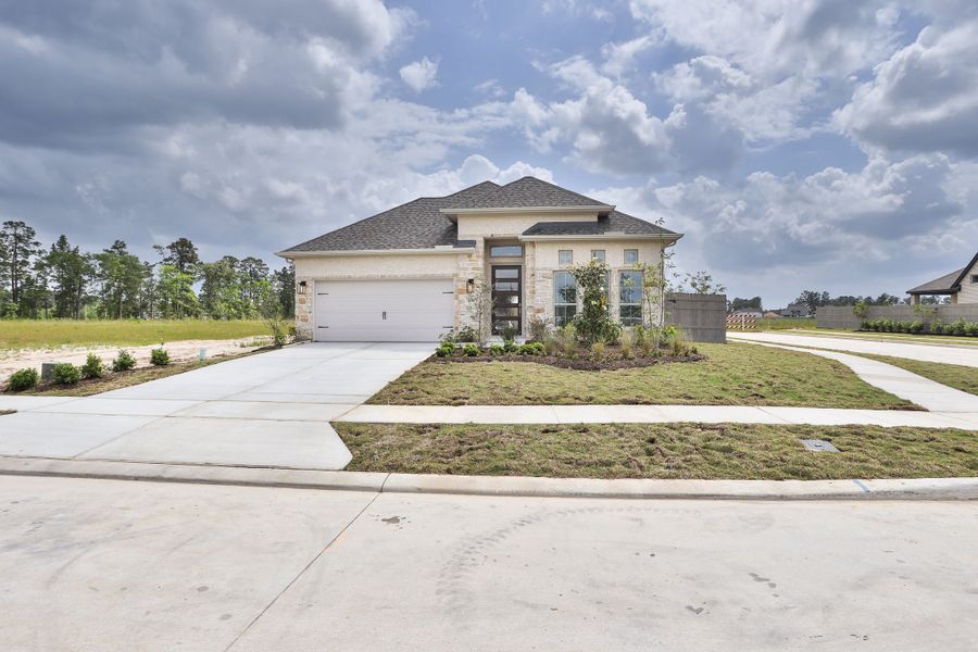 Representative exterior photo of a completed home built from the 2504W by Perry Homes in La Cima, San Marcos, TX (Image 32).