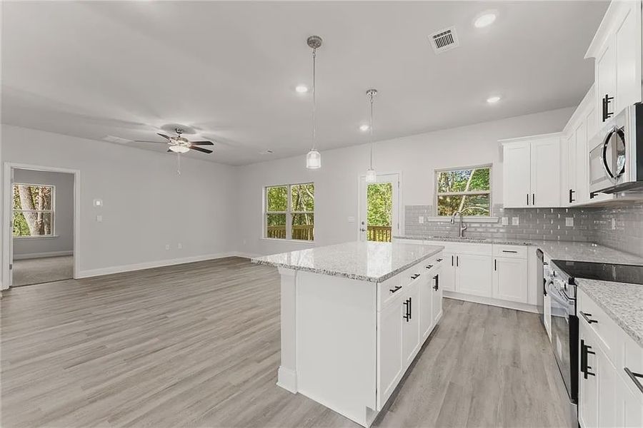 Furnished interior view inside a new home in Magnolia Villas, Cornelia (Image 4).
