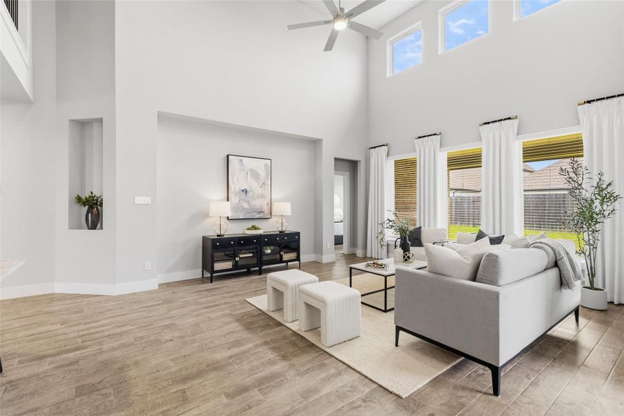 Designed for everyday living and entertaining, your bright family room features dramatic two-story ceilings and seamless flow into the kitchen and dining areas.