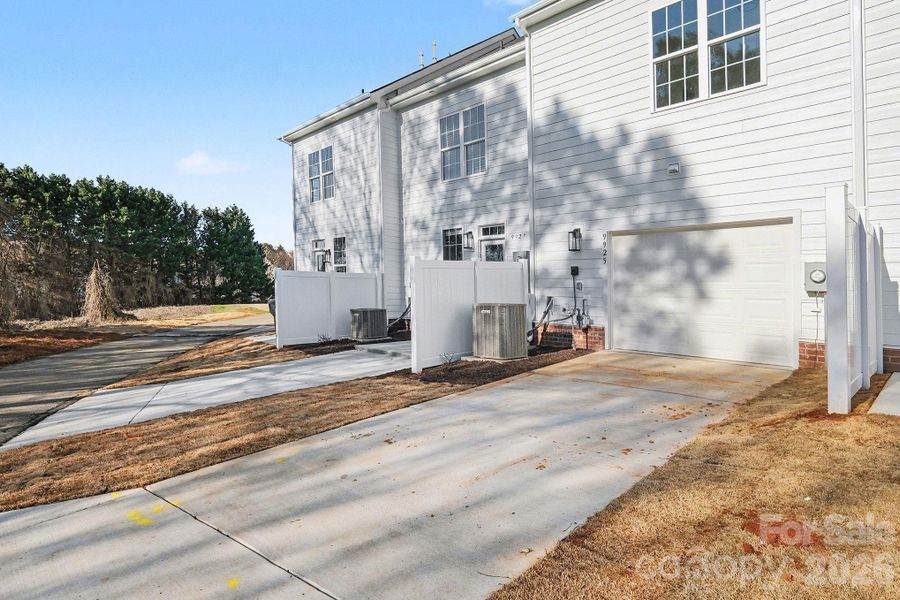 Additional parking on concrete drive behind garage