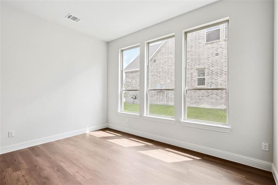 Spare room featuring light wood-type flooring