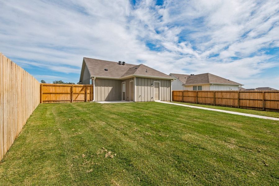 Exterior details and patio area of a home in The Cottages at Pagosa Springs, Bryan (Image 3).