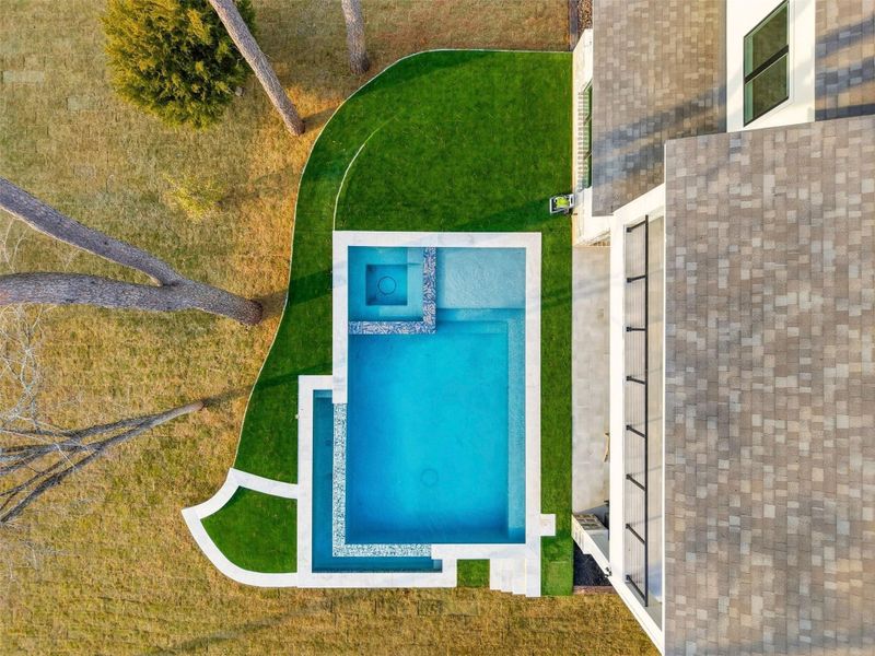 Infinity Edge Pool with Hot Tub and Turf Surrounds