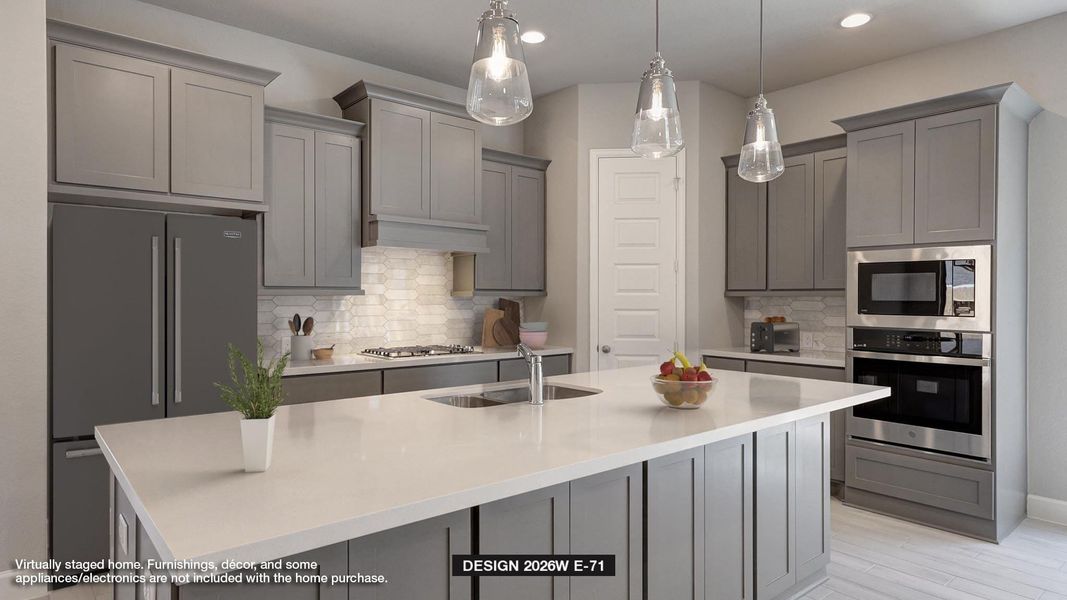 Kitchen featuring appliances with stainless steel finishes, gray cabinetry, tasteful backsplash, an island with sink, and light countertops
