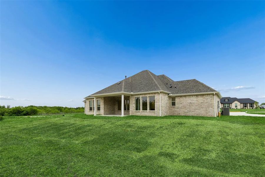Exterior details and patio area of a home in Ellis Ranch Estates, Waxahachie (Image 21).