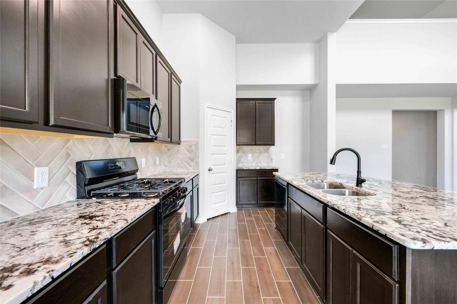 You'll have more than enough storage space with ample upper and lower cabinets, plus a walk-in pantry.