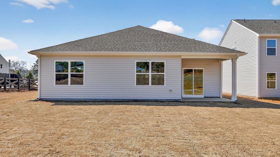 Exterior details and patio area of a home in Tyler - Home on the Lake, New Bern (Image 21).