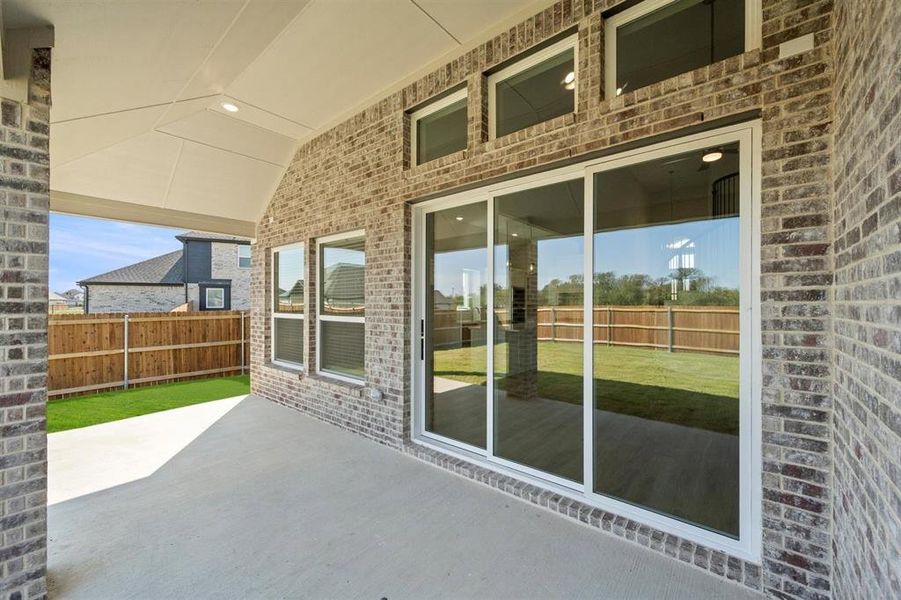Exterior details and patio area of a home in Oaks of North Grove, Waxahachie (Image 21).