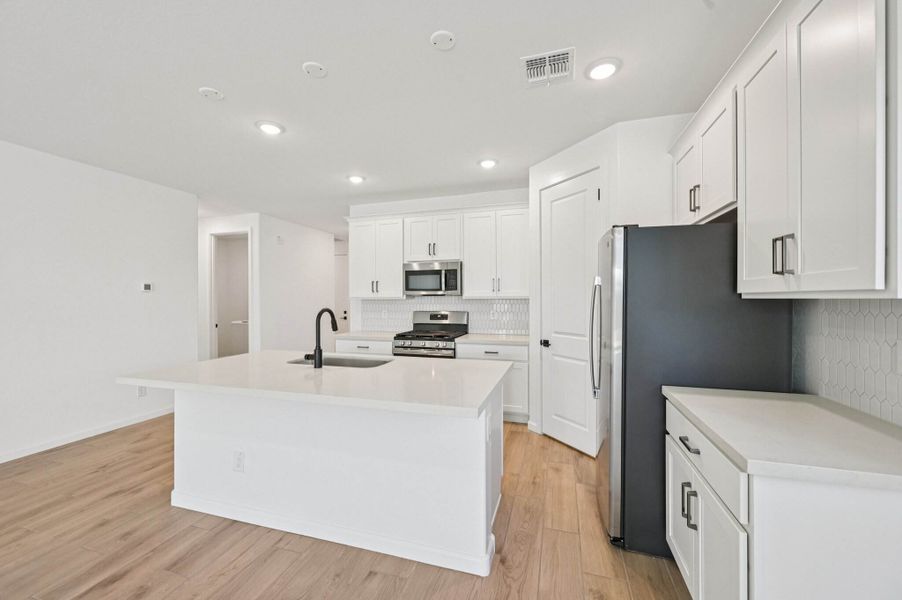 Kitchen featuring the Harmony Collection. Finishes and options may vary by community.