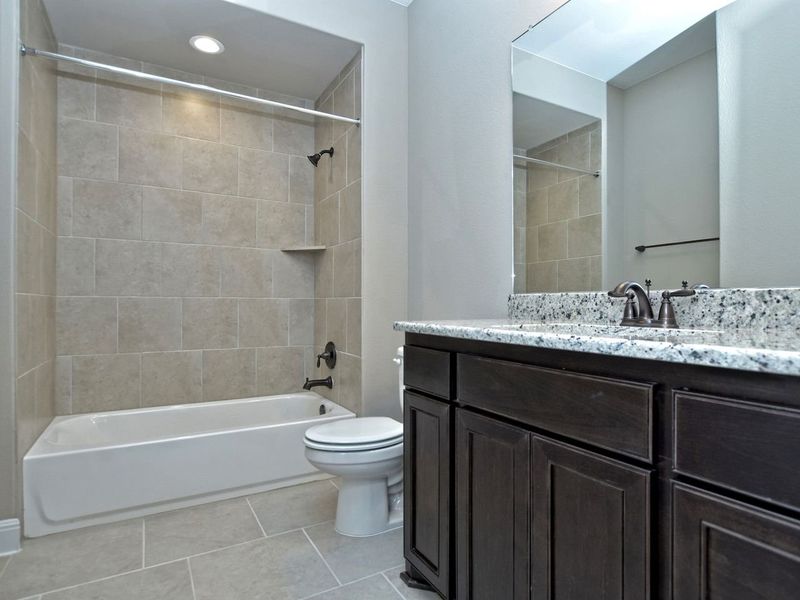 Representative furnished interior of a home built from the Madera II by Giddens Homes in Scofield Farms Estates, Georgetown (Image 253).