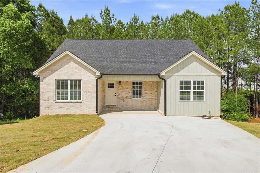 Front exterior of a new home in , Calhoun, GA, highlighting curb appeal (Image 26). Front exterior of a new home in , Calhoun, GA, highlighting curb appeal (Image 26).