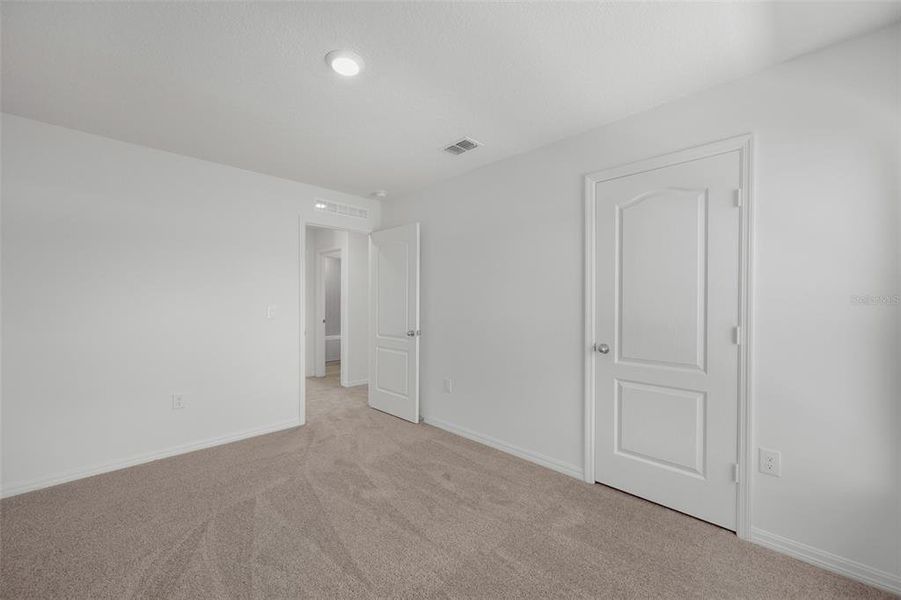 Spacious, unfurnished interior of a new home in Peach Crossings, Winter Haven (Image 24).