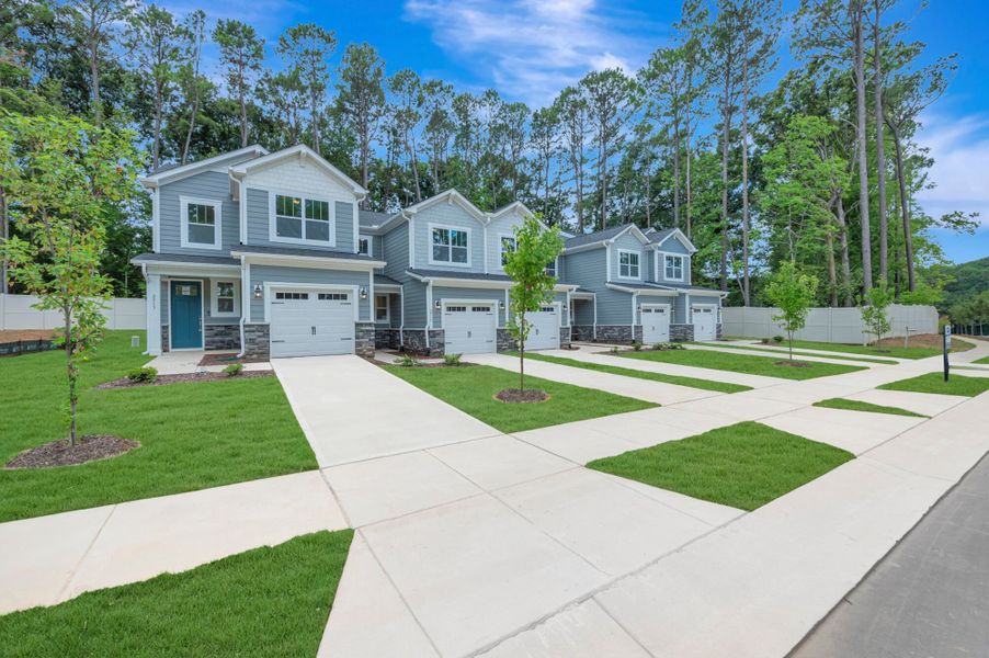 Front exterior of a new home in Ashmore Townes, Garner, NC, highlighting curb appeal (Image 2). Front exterior of a new home in Ashmore Townes, Garner, NC, highlighting curb appeal (Image 2).