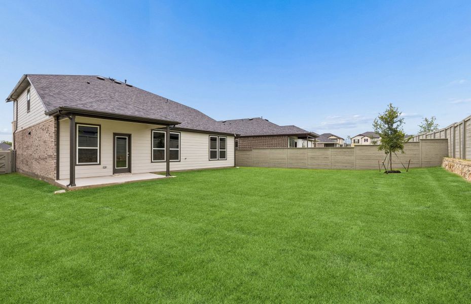 Exterior details and patio area of a home in Treeline, Justin (Image 2).